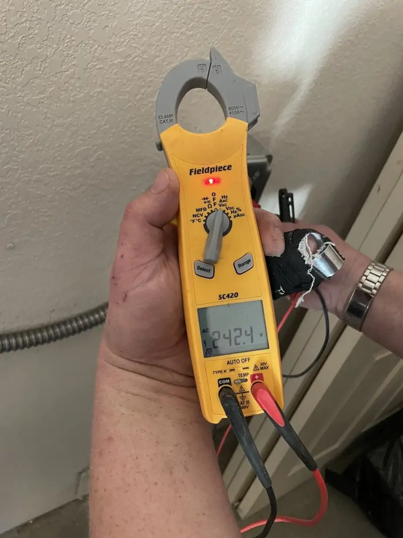 Voltage testing with clamp meter during Ceiling Fan Installation in Dandridge